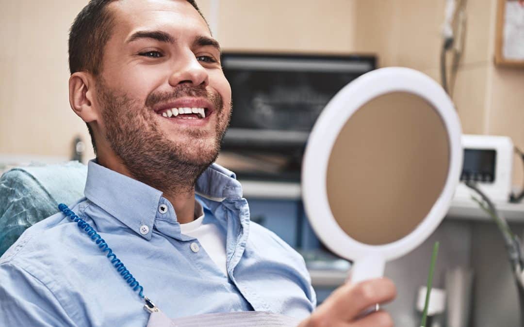 man during prosthodontic care dentist appointment at bright dental studio